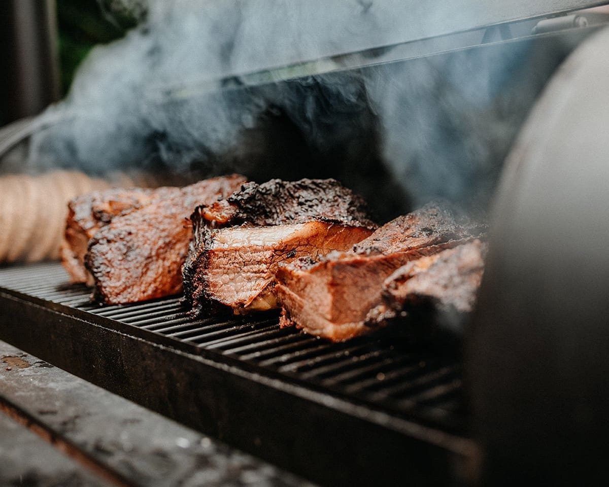 Smoked meat on grill