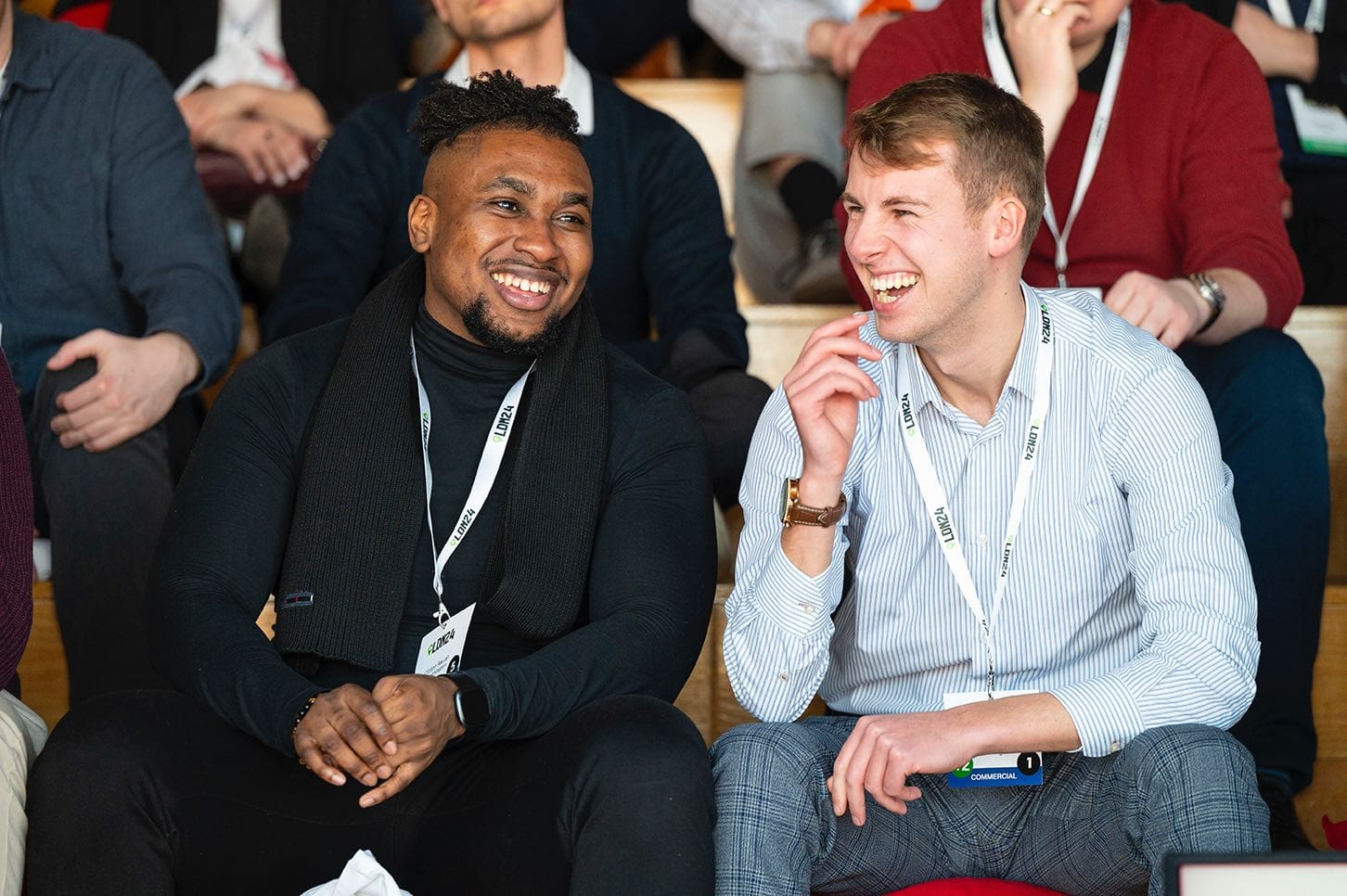 Two Expana employees smiling and laughing