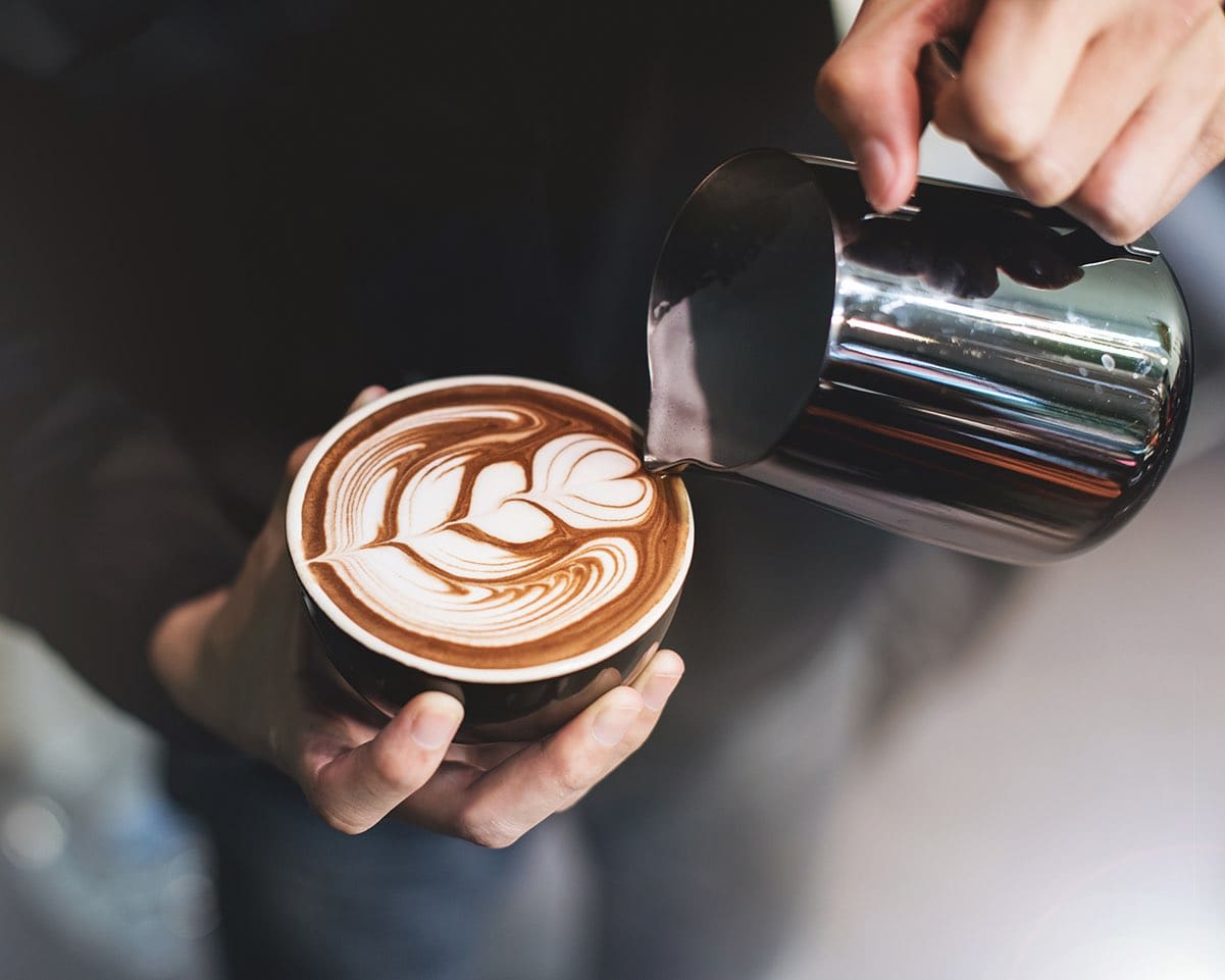 Barista make coffee cup latte art