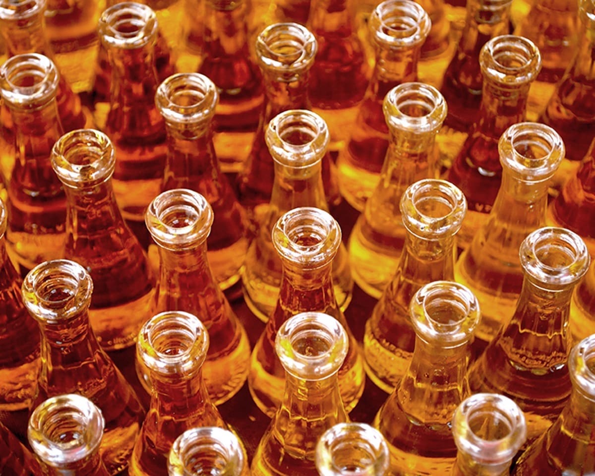 Glass bottles containing a orange liquid