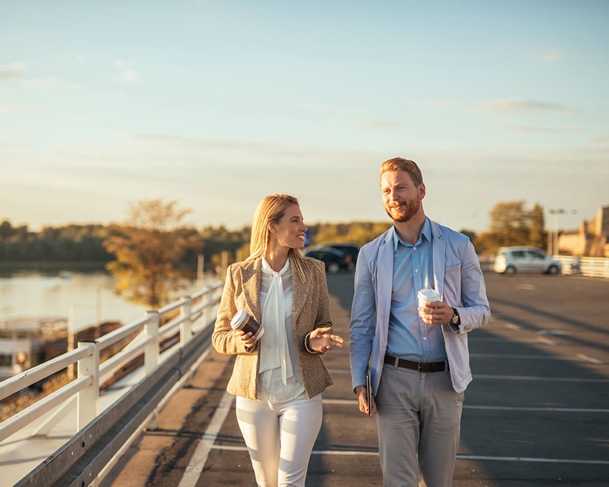 Two people walk outdoors