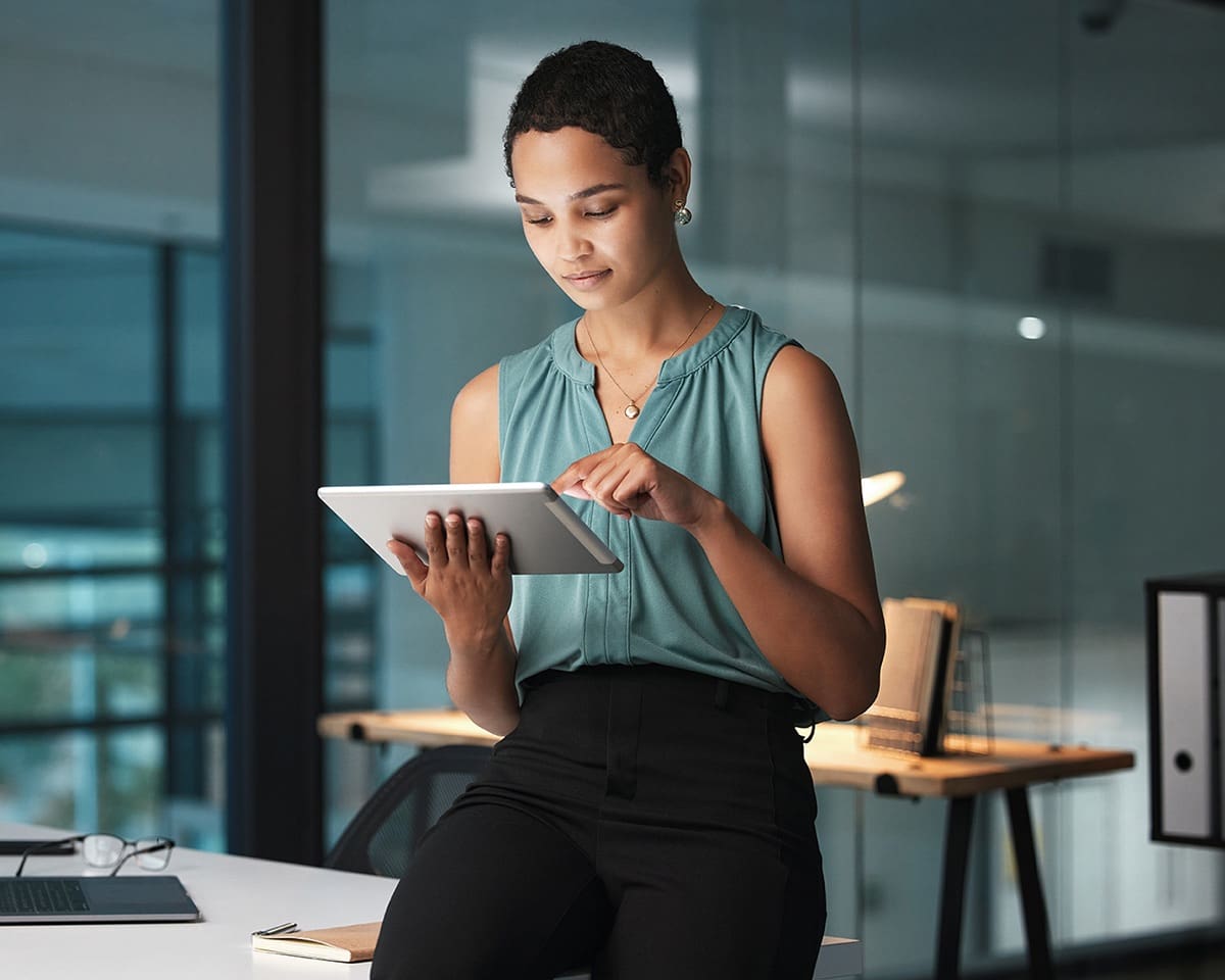 Businesswoman on a tablet in an office