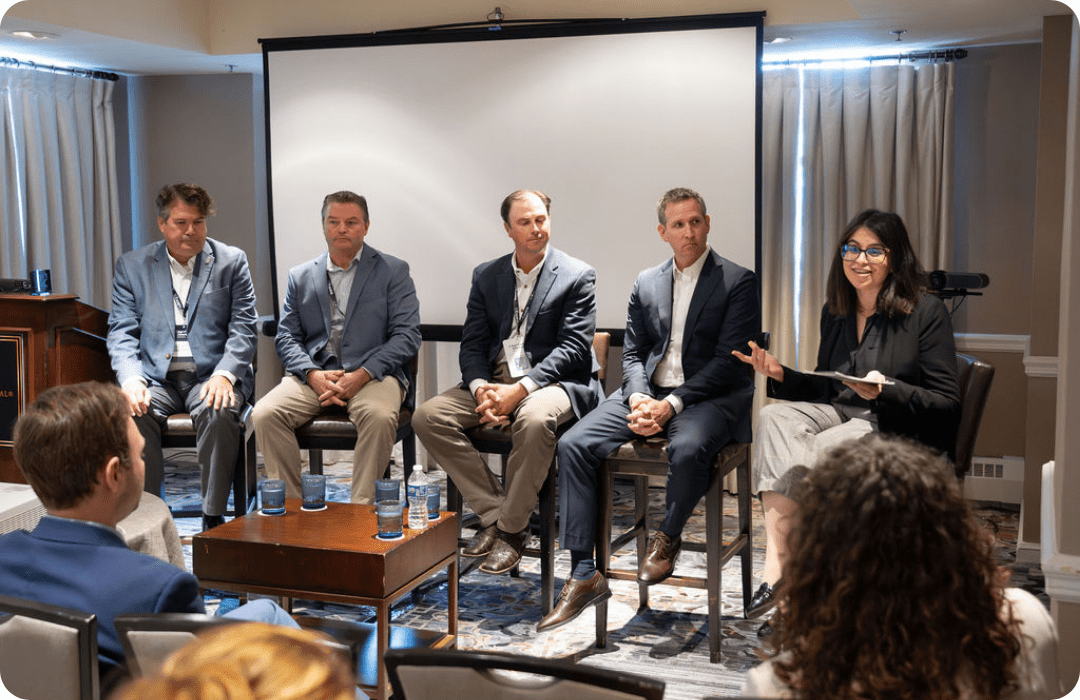 Panel of speakers talking to an audience