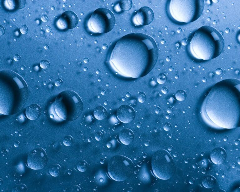 Liquid droplets on a blue background